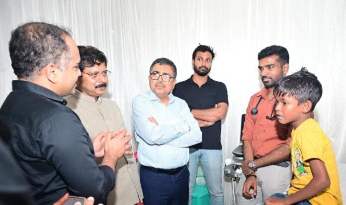 Doctors examining children during Gift of Life heart screening camp in Bokaro